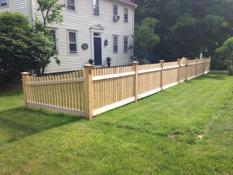 Hand-pointed Northern White Cedar picket fence with arched gate and transition section, Arrow Fence Inc